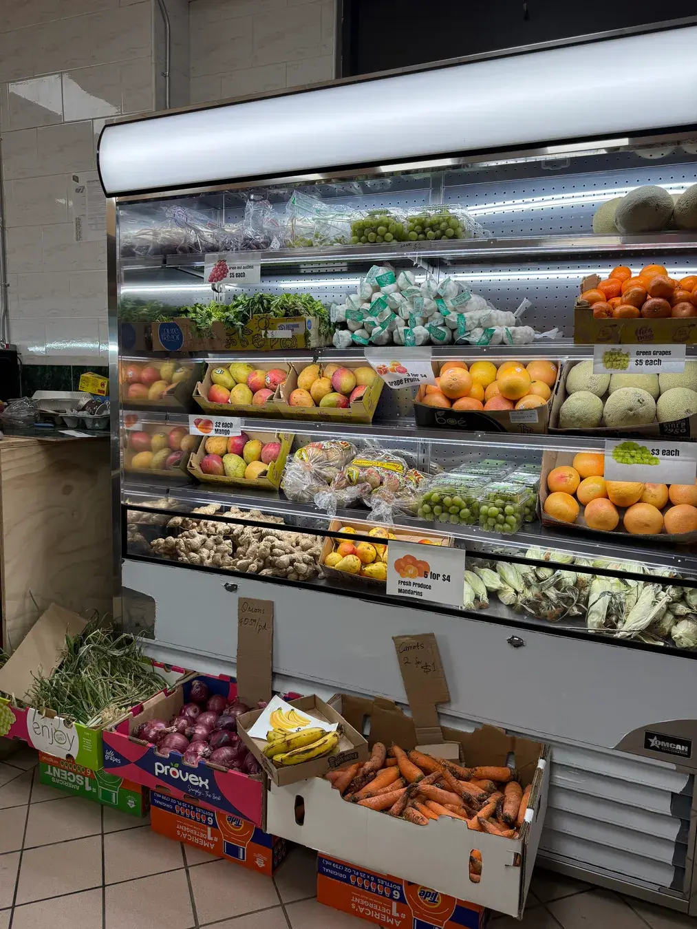 Fresh produce and aisles inside Mercado La Riqueza